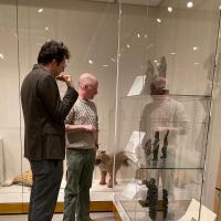 Benjamin Anderson and Jakub Koguciuk viewing display cases