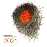 Nest artwork with orange yarn woven through branches