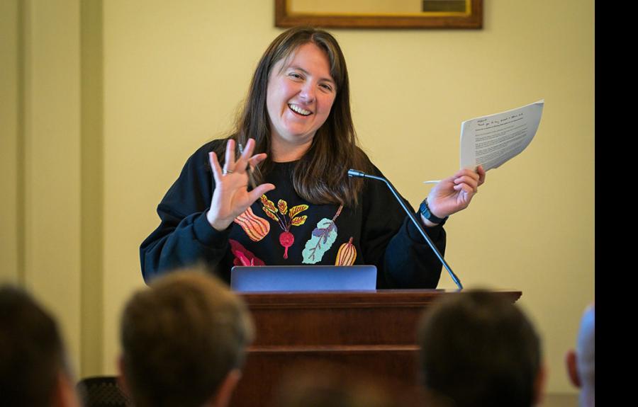 Dawn LaValle Norman standing at a podium presenting at the fall 2024 Fellows' Conference