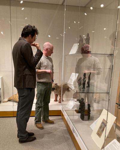 Benjamin Anderson and Jakub Koguciuk viewing display cases